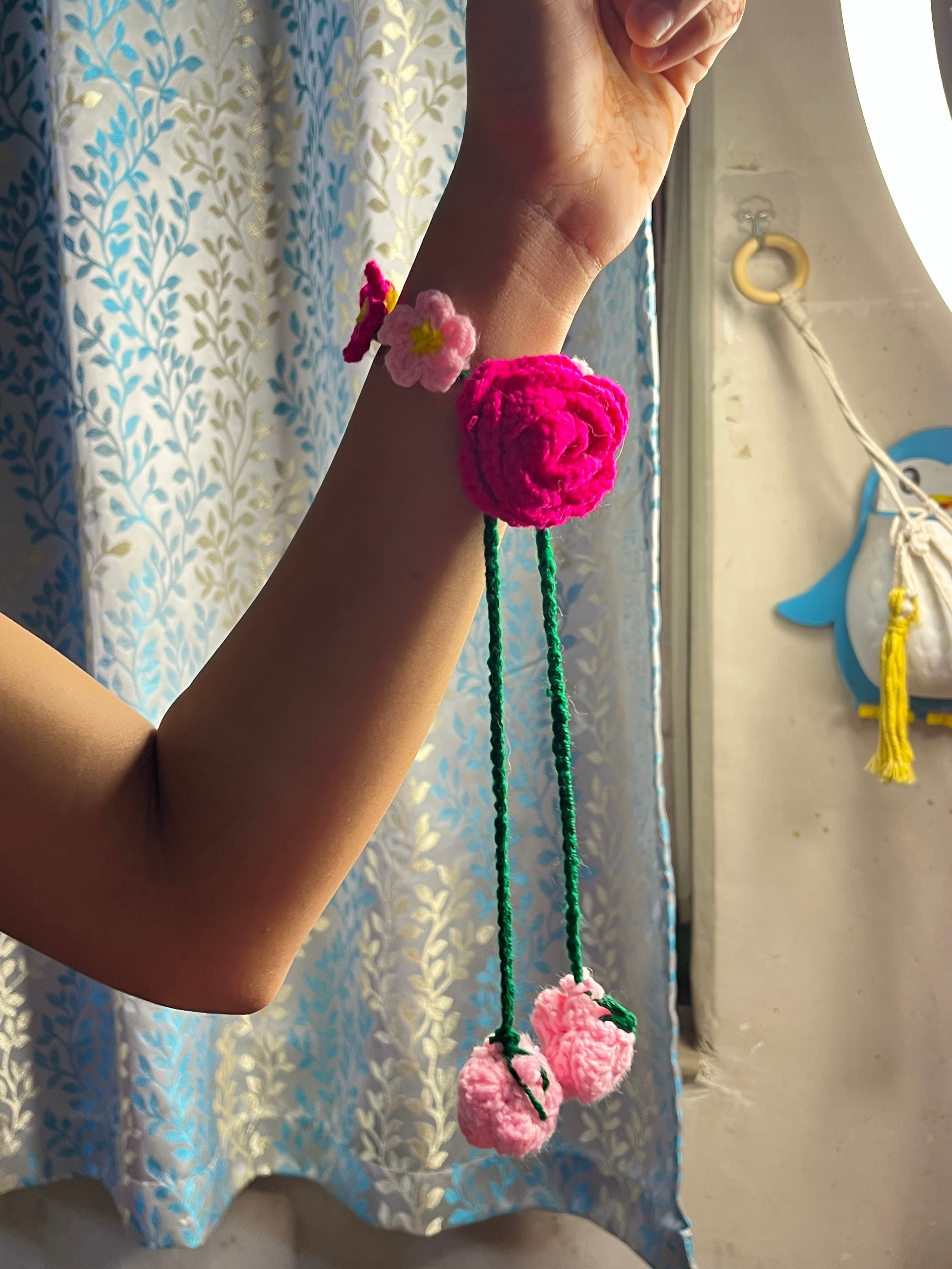 Bloomie pink floral latkan rakhi crochet jewellery
